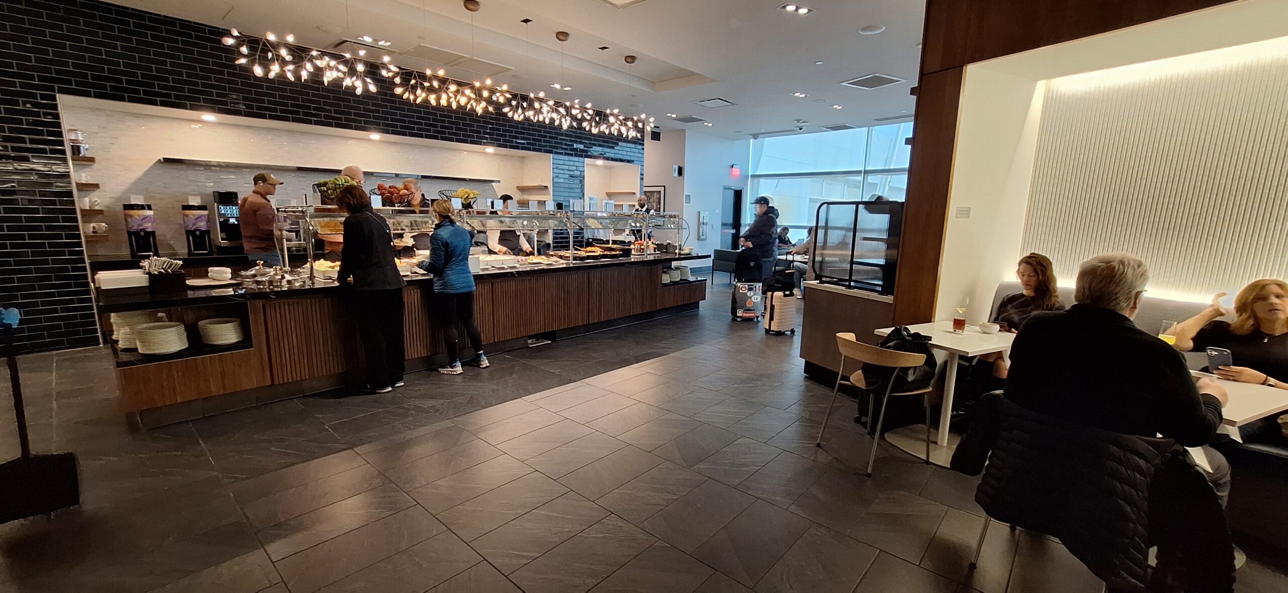 Centurion Lounge Las Vegas people standing in a cafeteria