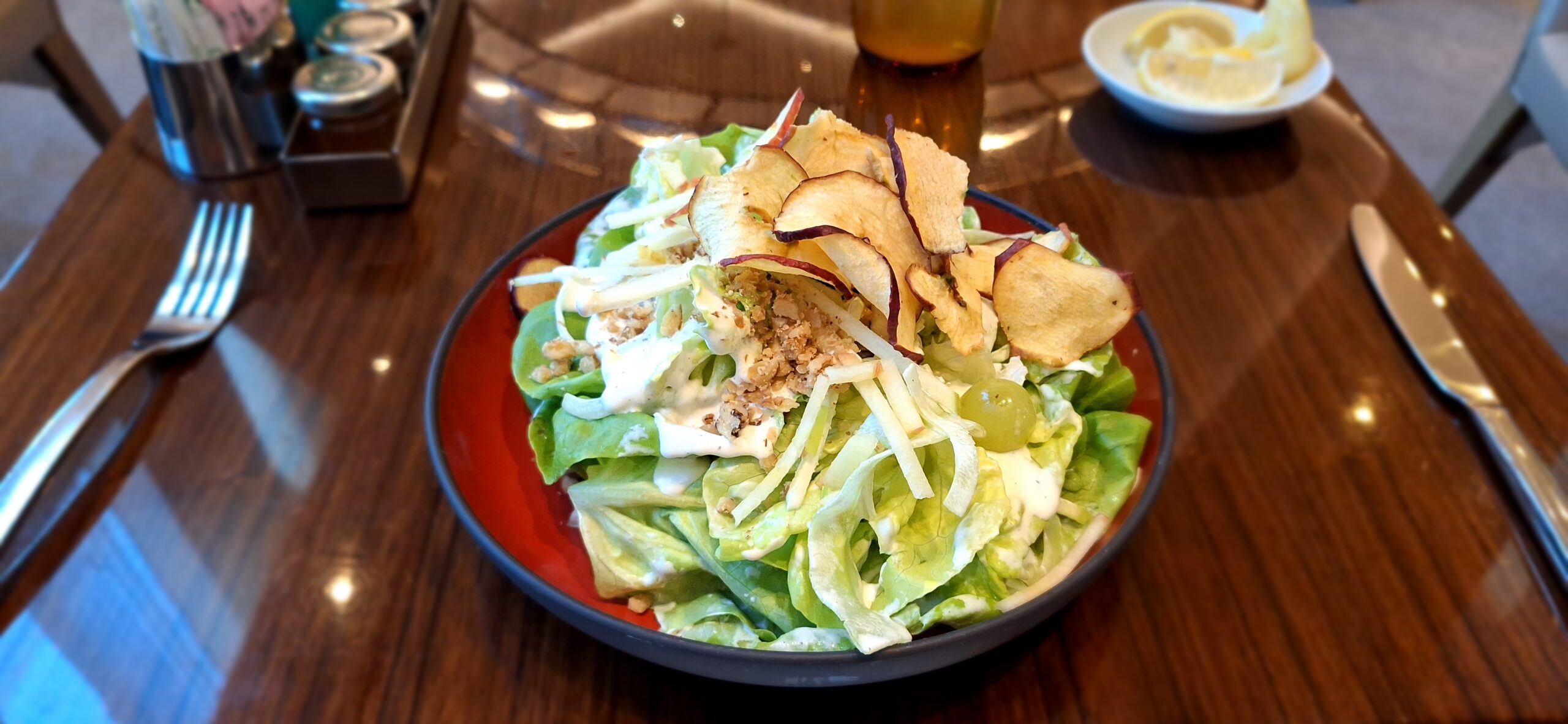 a salad with apples and cheese on a plate
