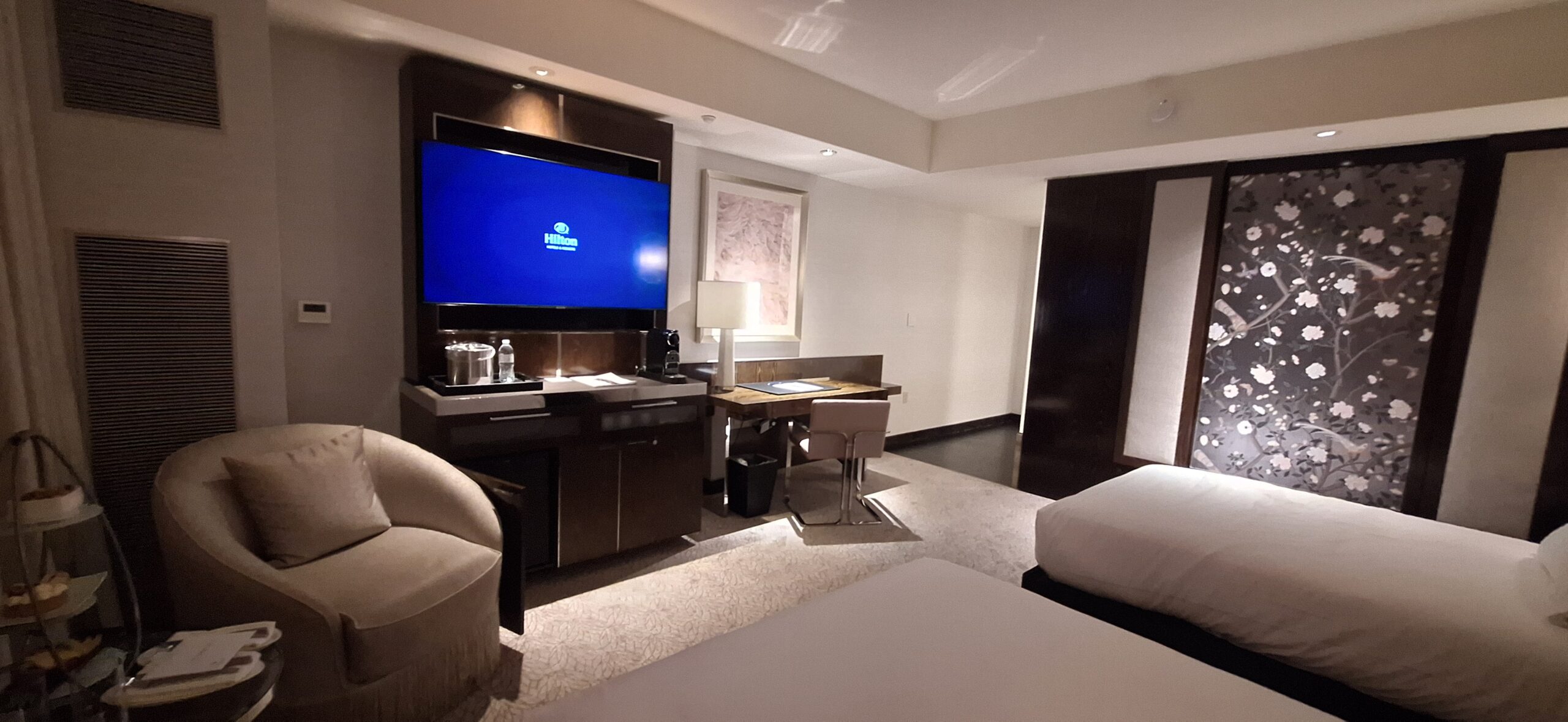 a room with a television and a desk