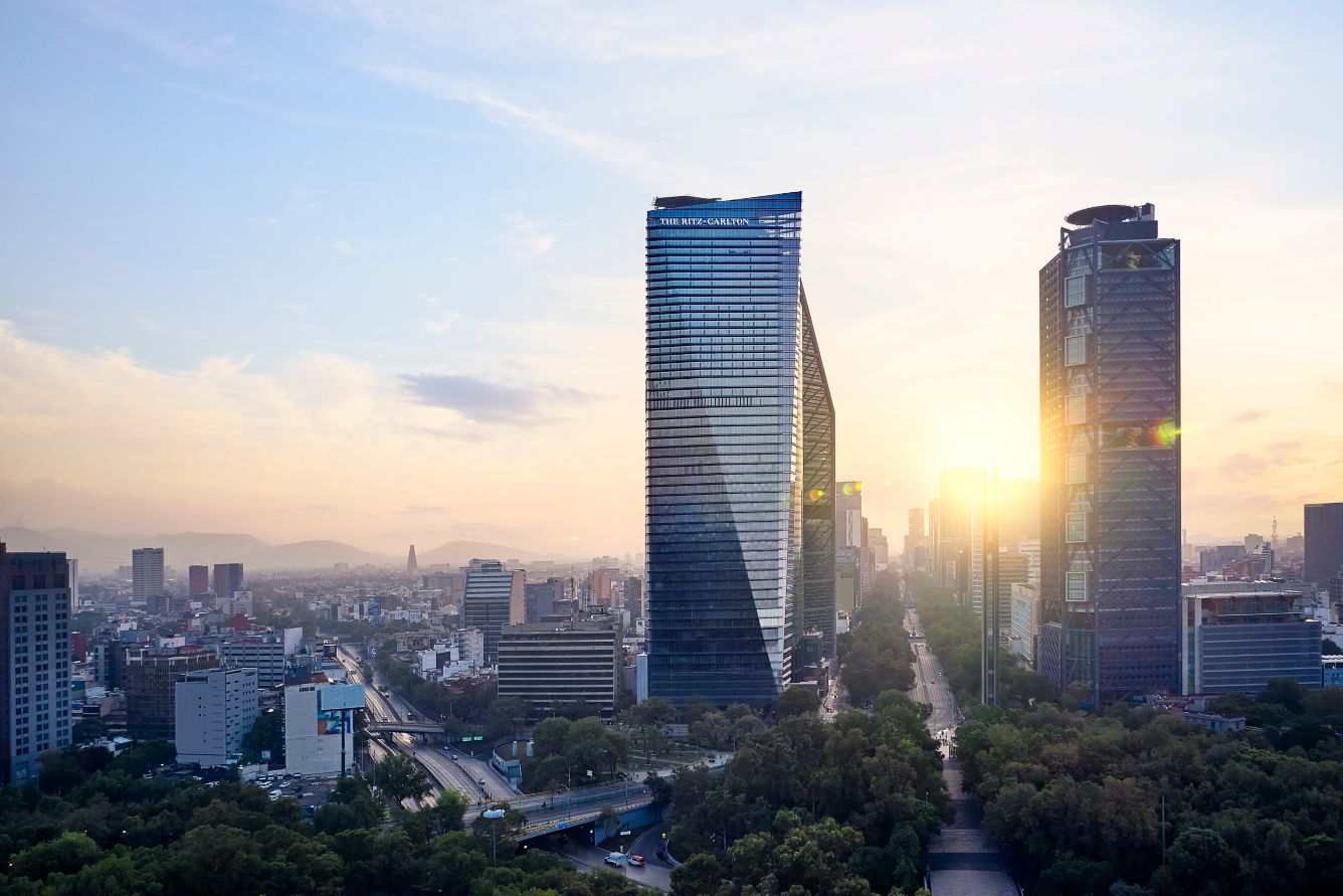 a city with tall buildings and trees