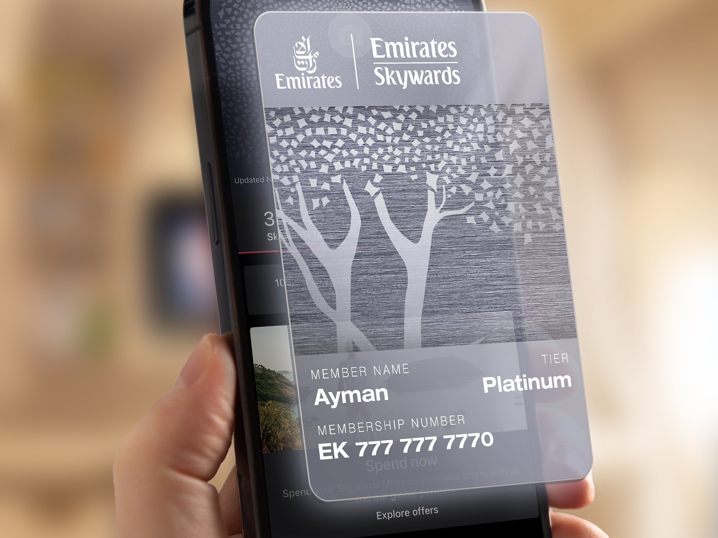 a hand holding a cell phone with a transparent screen