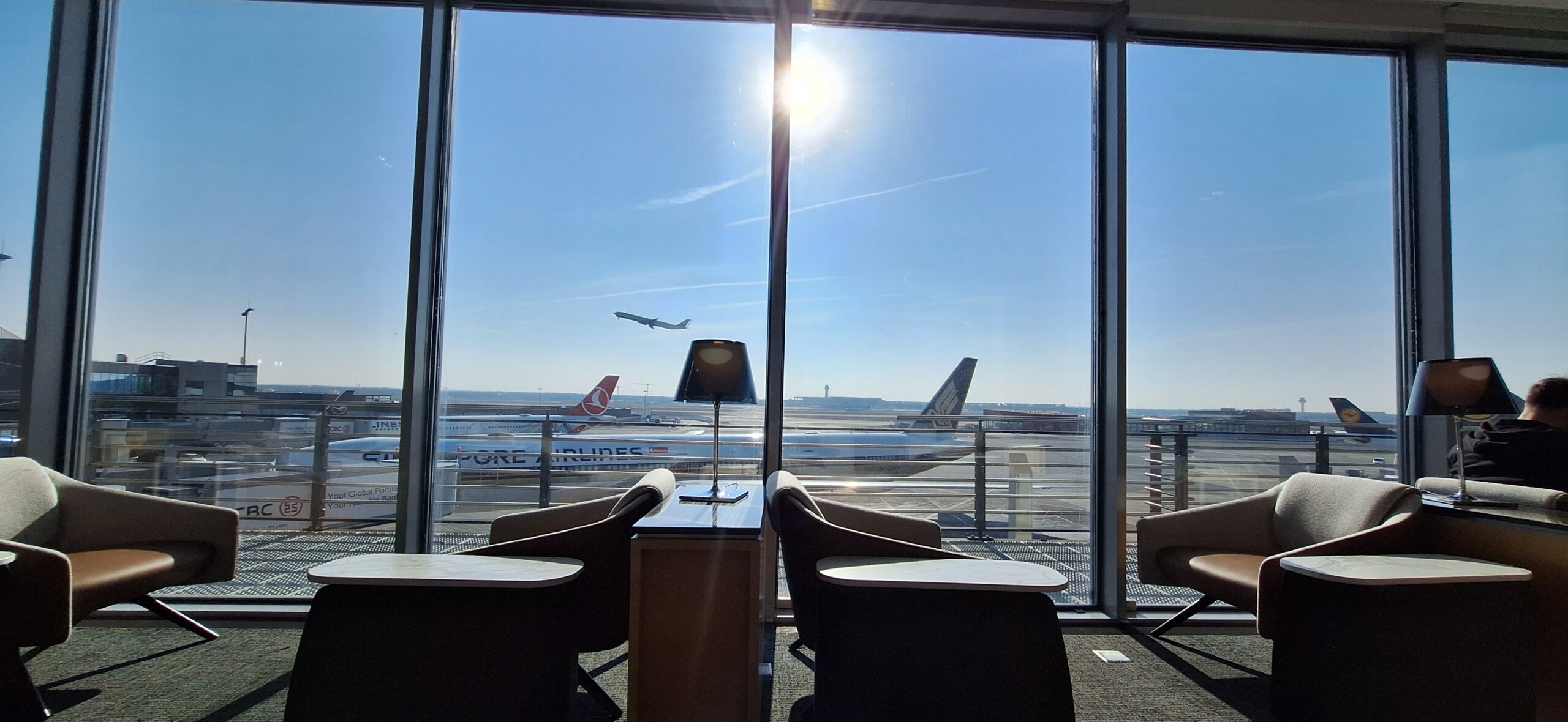 a window with a view of airplanes in the background