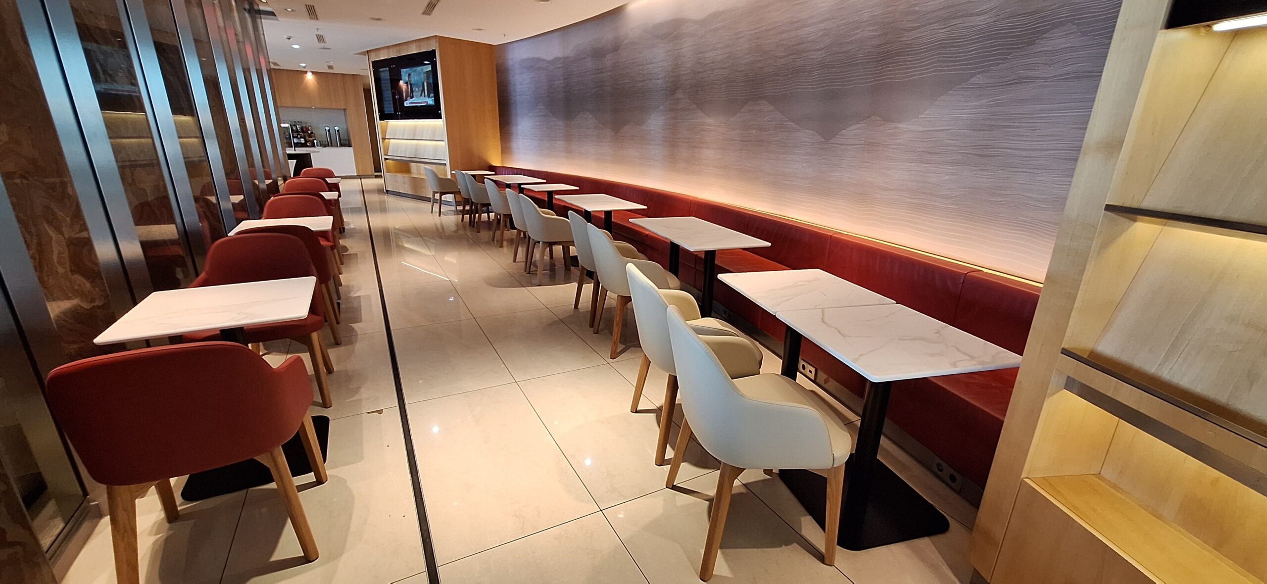 a row of tables and chairs in a room