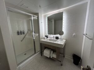 a bathroom with a shower and sink