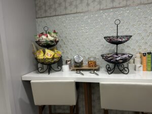 a two tiered metal baskets on a table