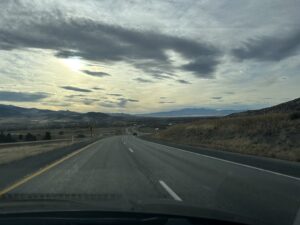a road with a cloudy sky