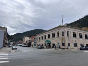 a street with cars and buildings in the background
