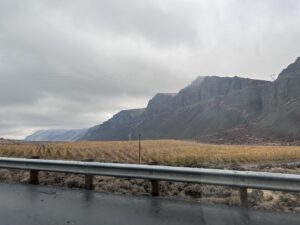a road with a mountain in the background