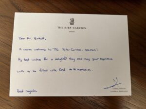 Ritz-Carlton Amman Review a letter on a table