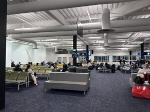 a group of people sitting in a waiting area