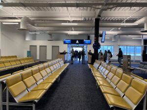 a group of people walking in an airport terminal