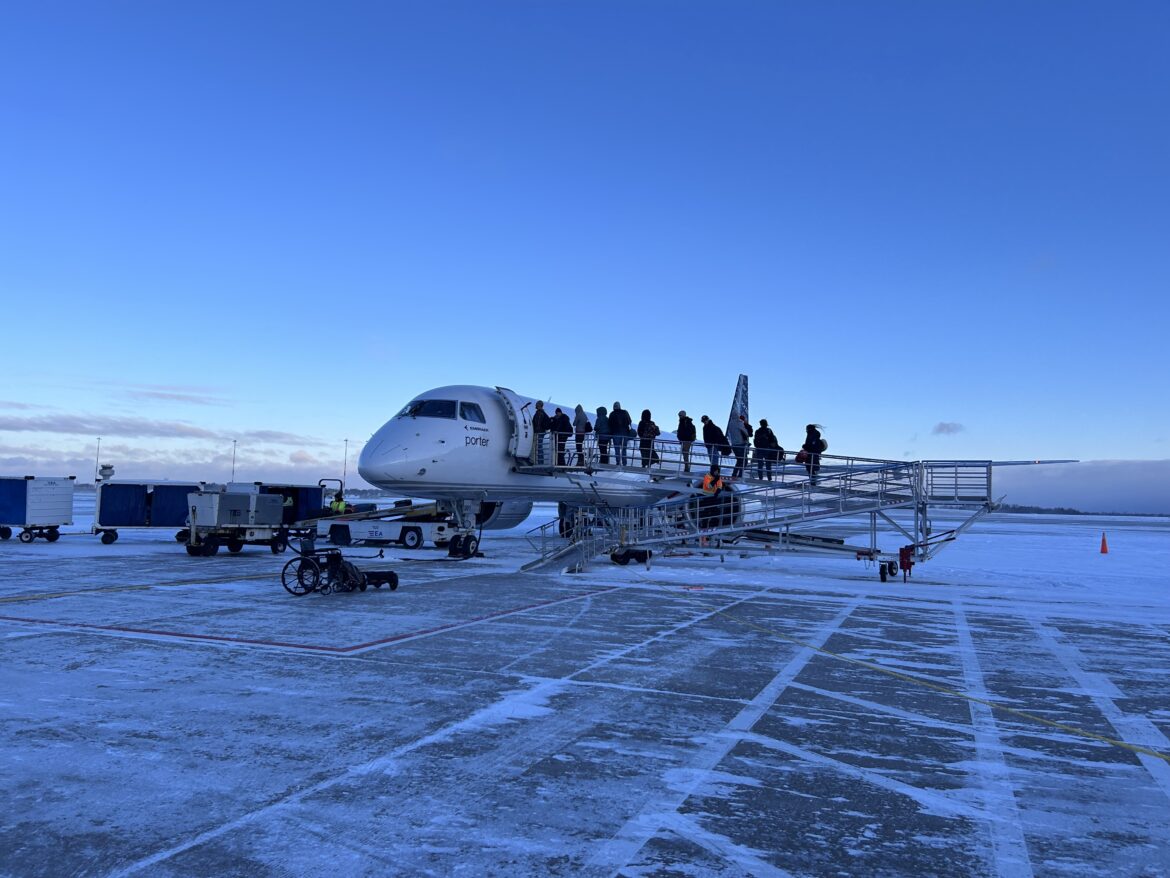 a group of people standing on a plane