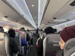 a group of people sitting in an airplane