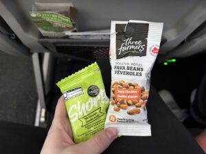 a hand holding a packet of food