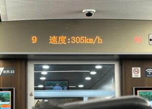 a sign with a man in the background