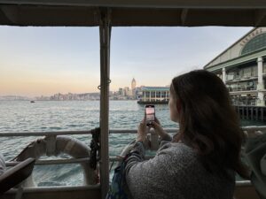 a woman taking a picture of a city