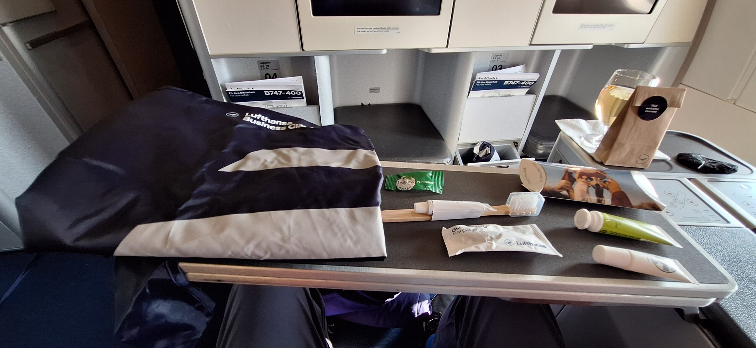 a table with a bag and toothbrushes on it