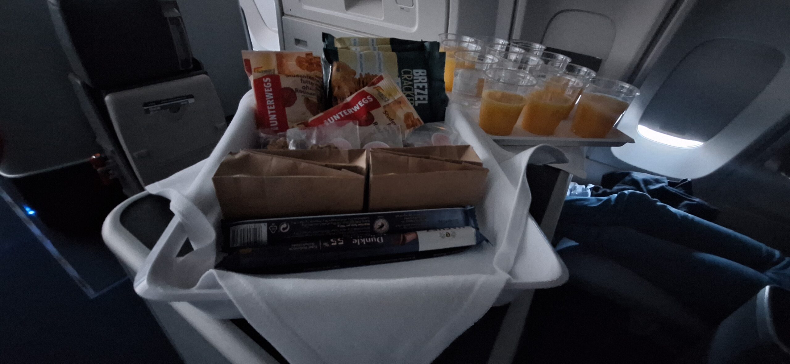 a tray of food and drinks on an airplane