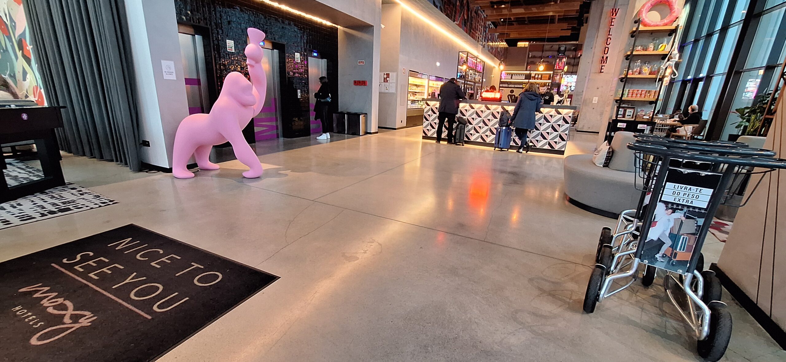a pink statue in a lobby