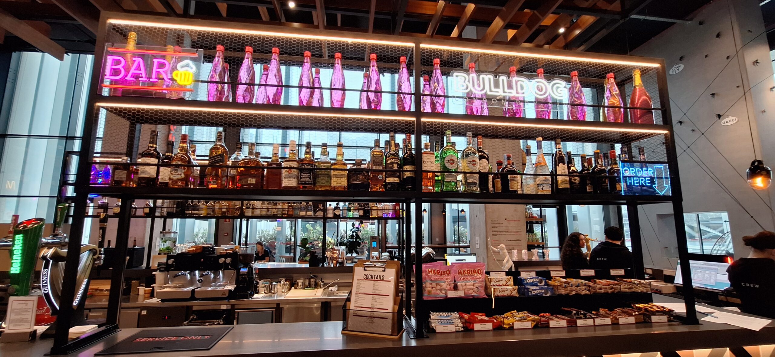 a shelf with bottles of liquor on it