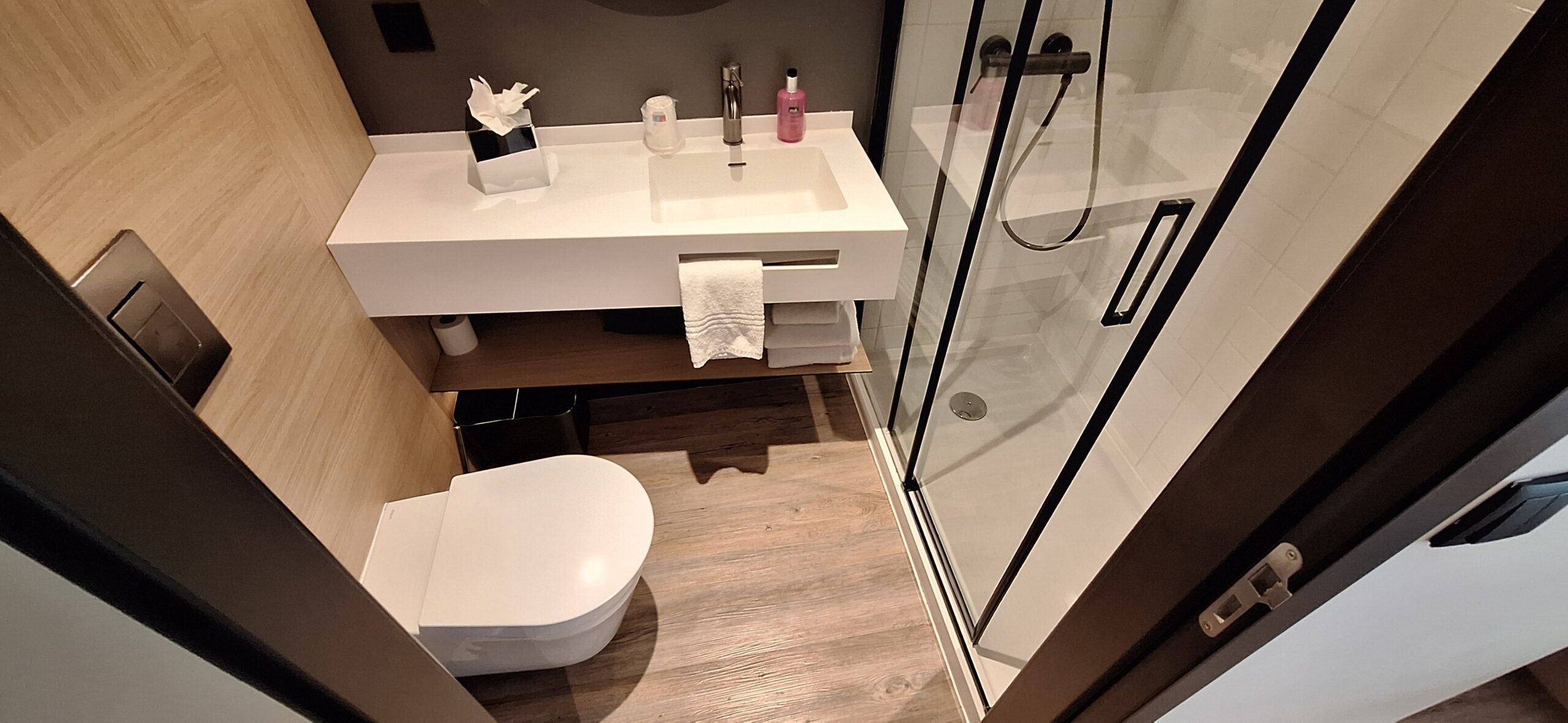 a bathroom with a shower and sink