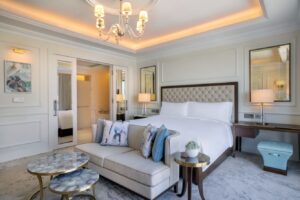 Ritz-Carlton Amman Review a bedroom with a bed and a couch