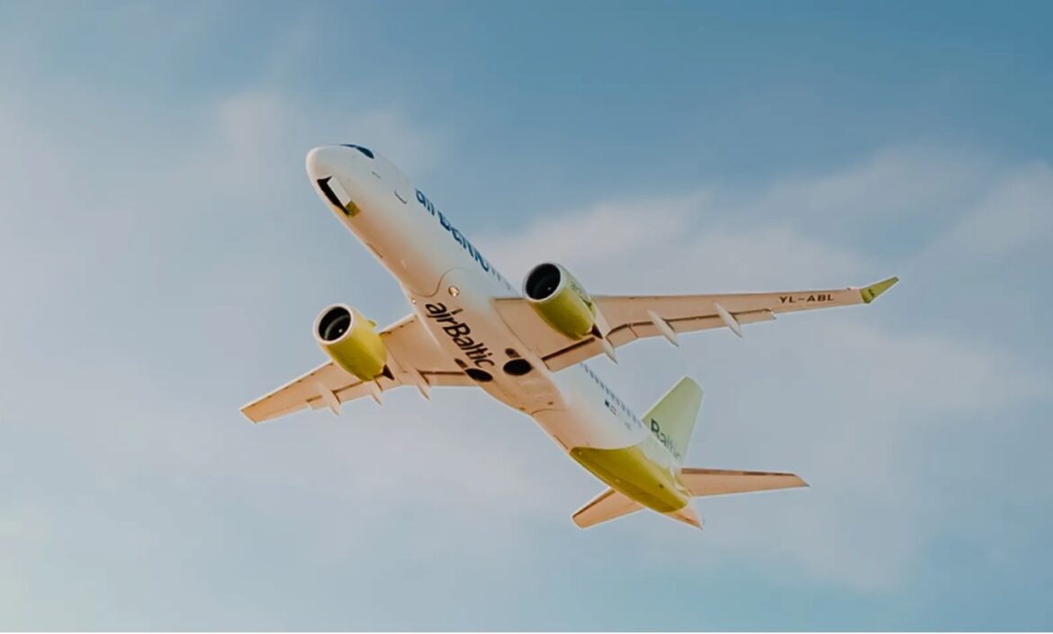 a white and yellow airplane flying in the sky