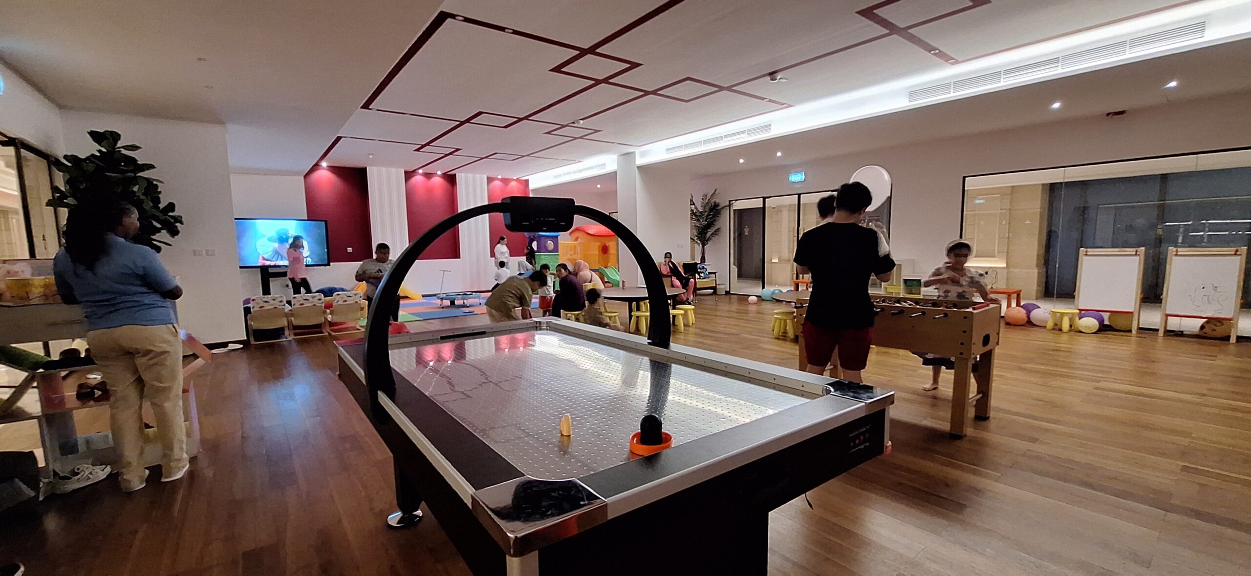 a group of people playing in a room