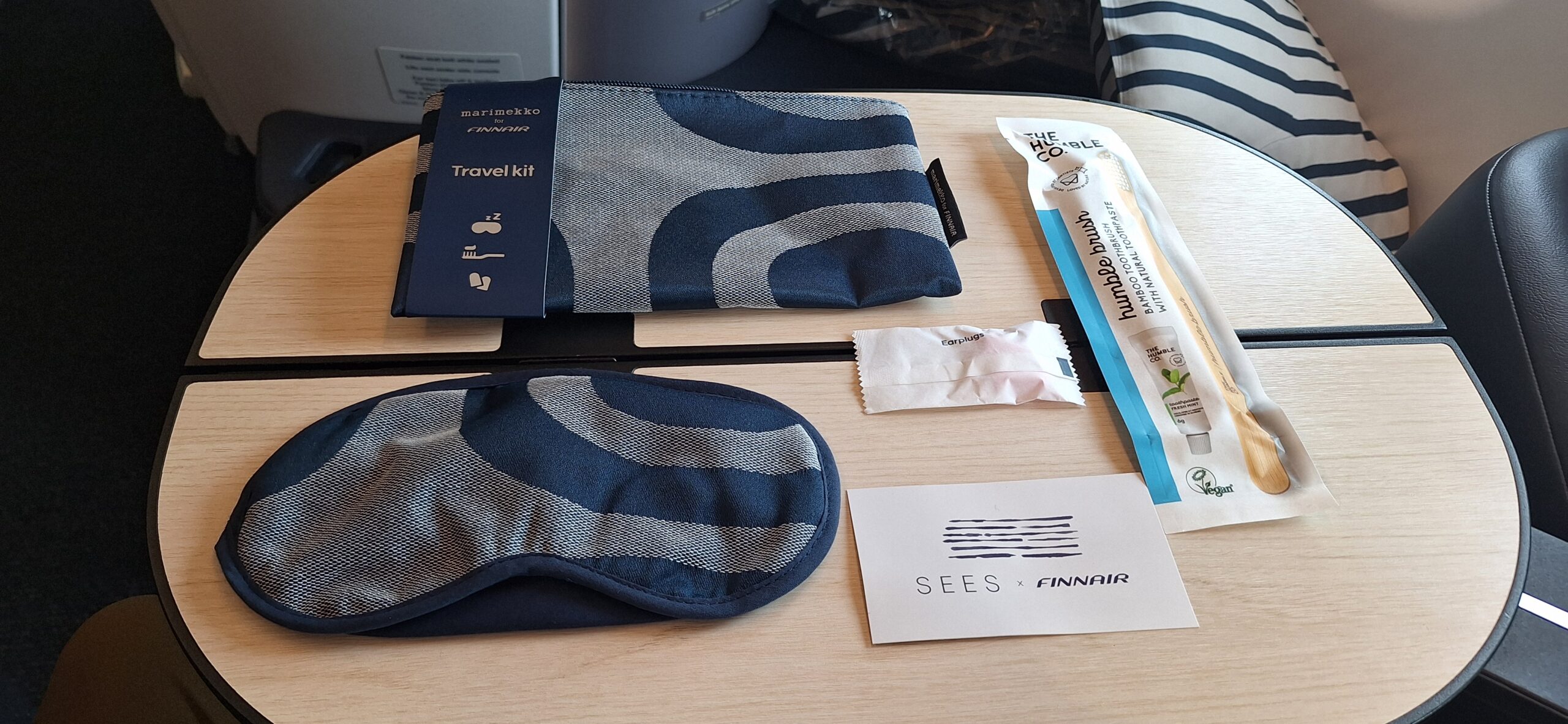 a pair of sleeping masks and a packet on a table