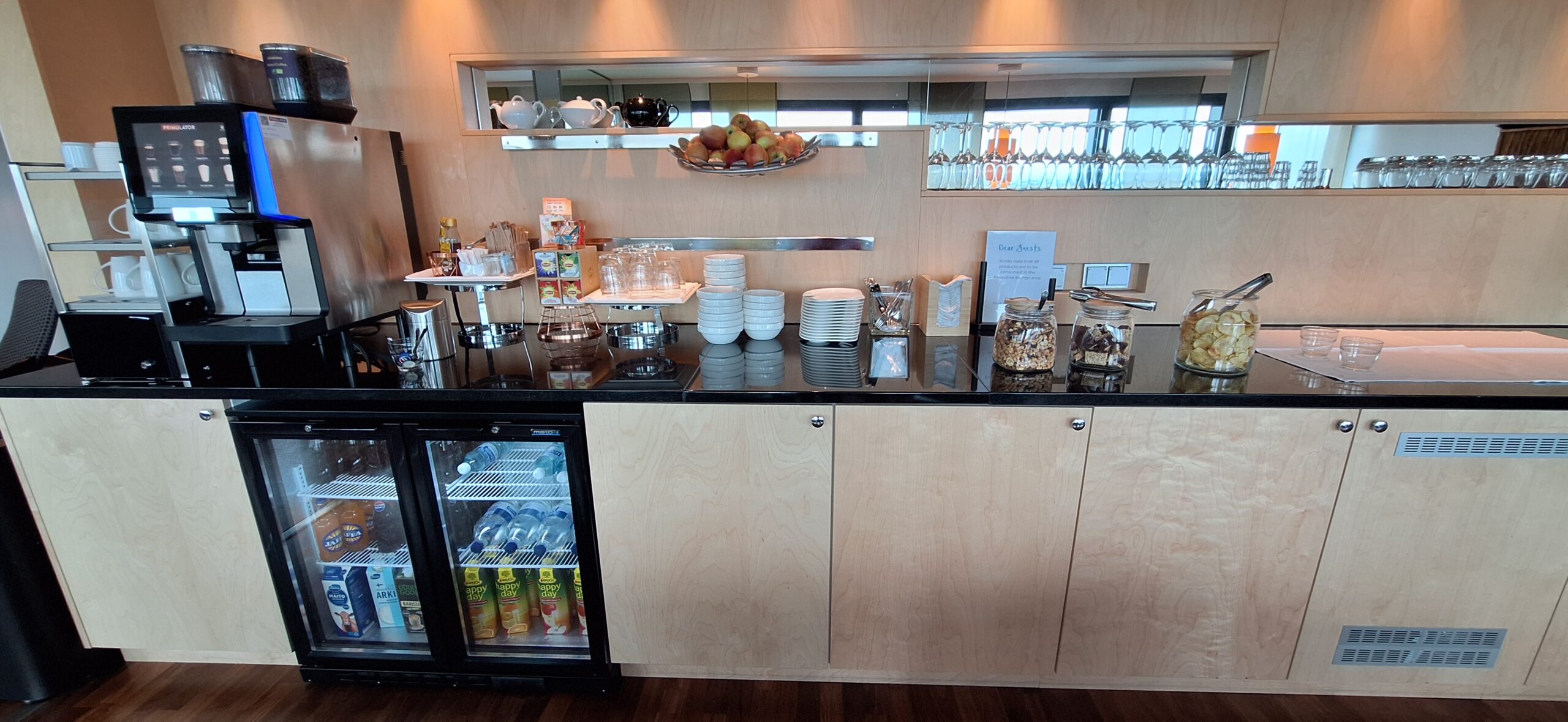 a counter with plates and glasses on it