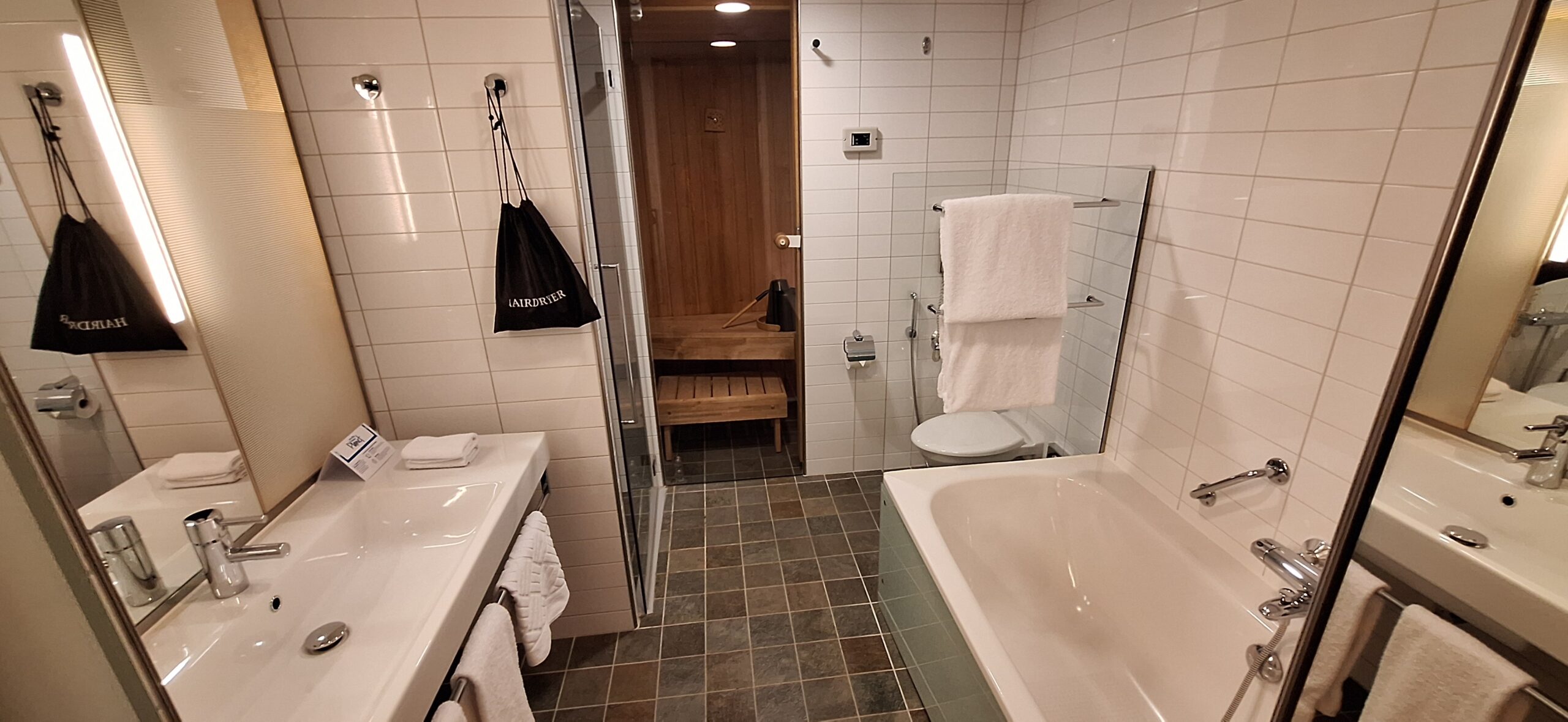 a bathroom with a bathtub and a tub