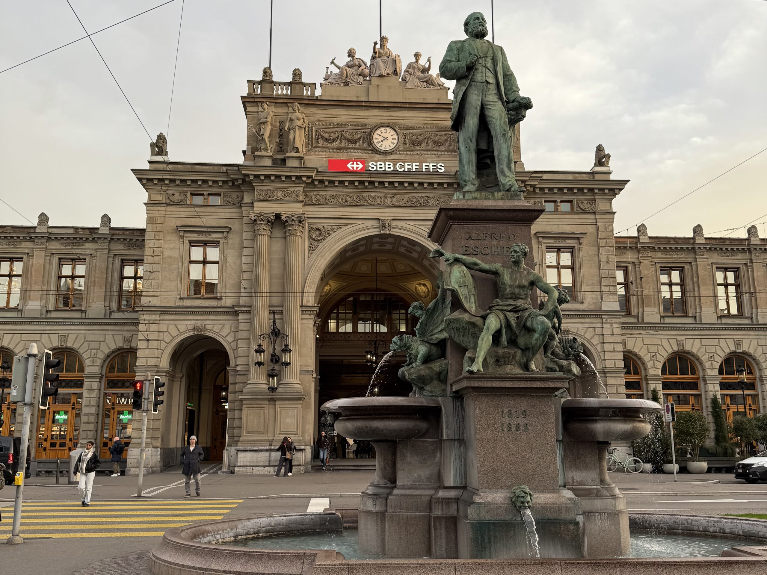 a statue of a man in front of a building
