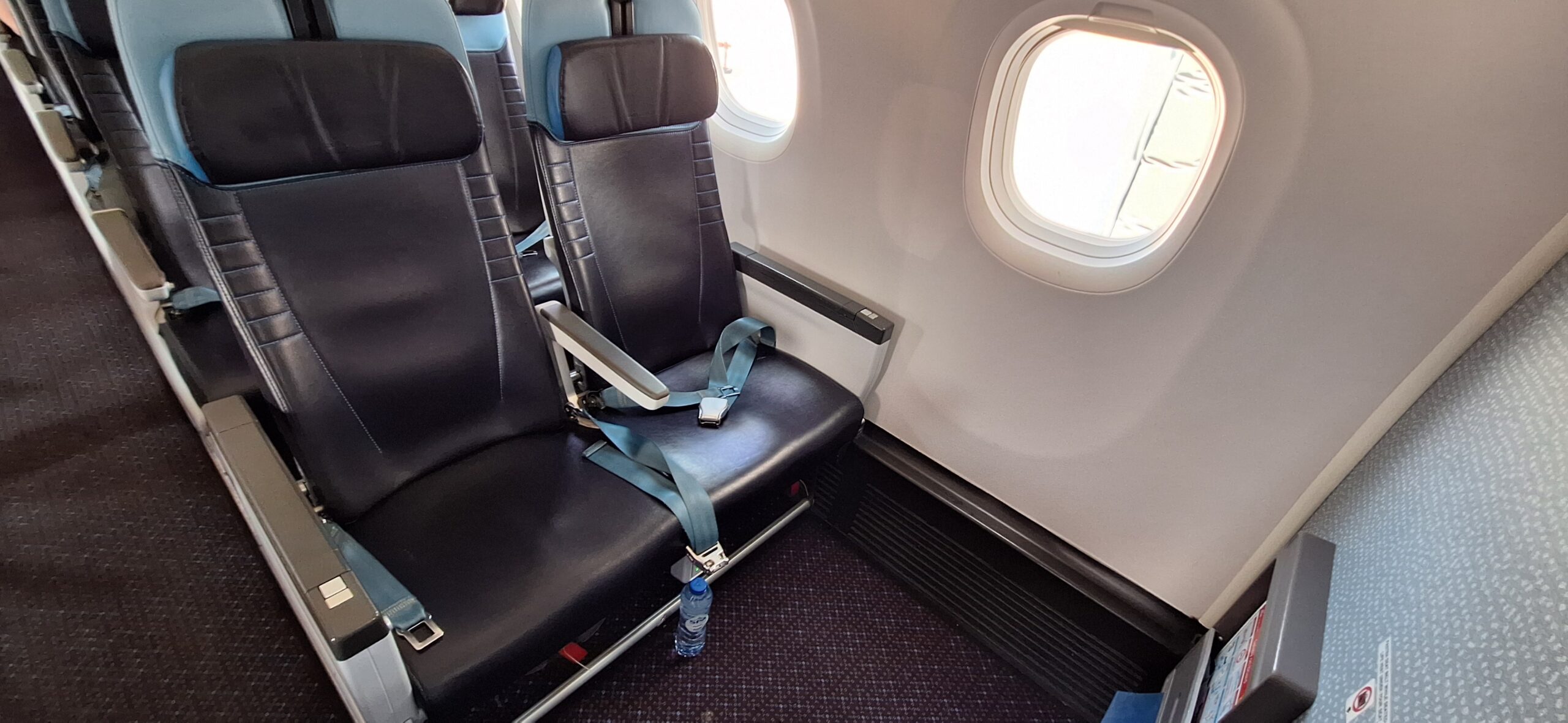 seat belts on a seat in a plane