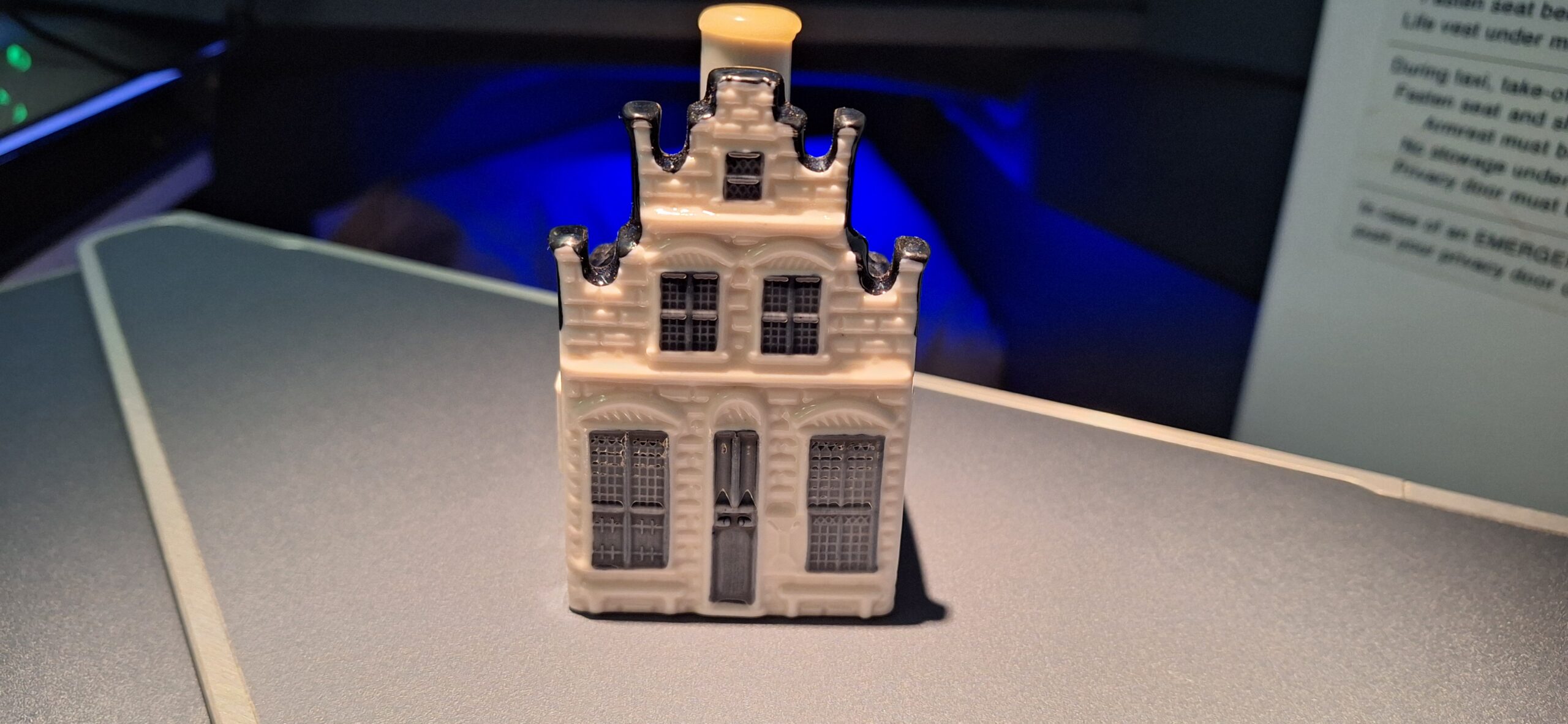 a small white and grey house