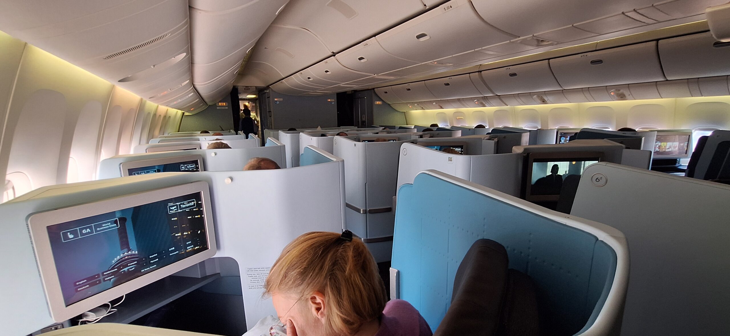 a woman sleeping in an airplane