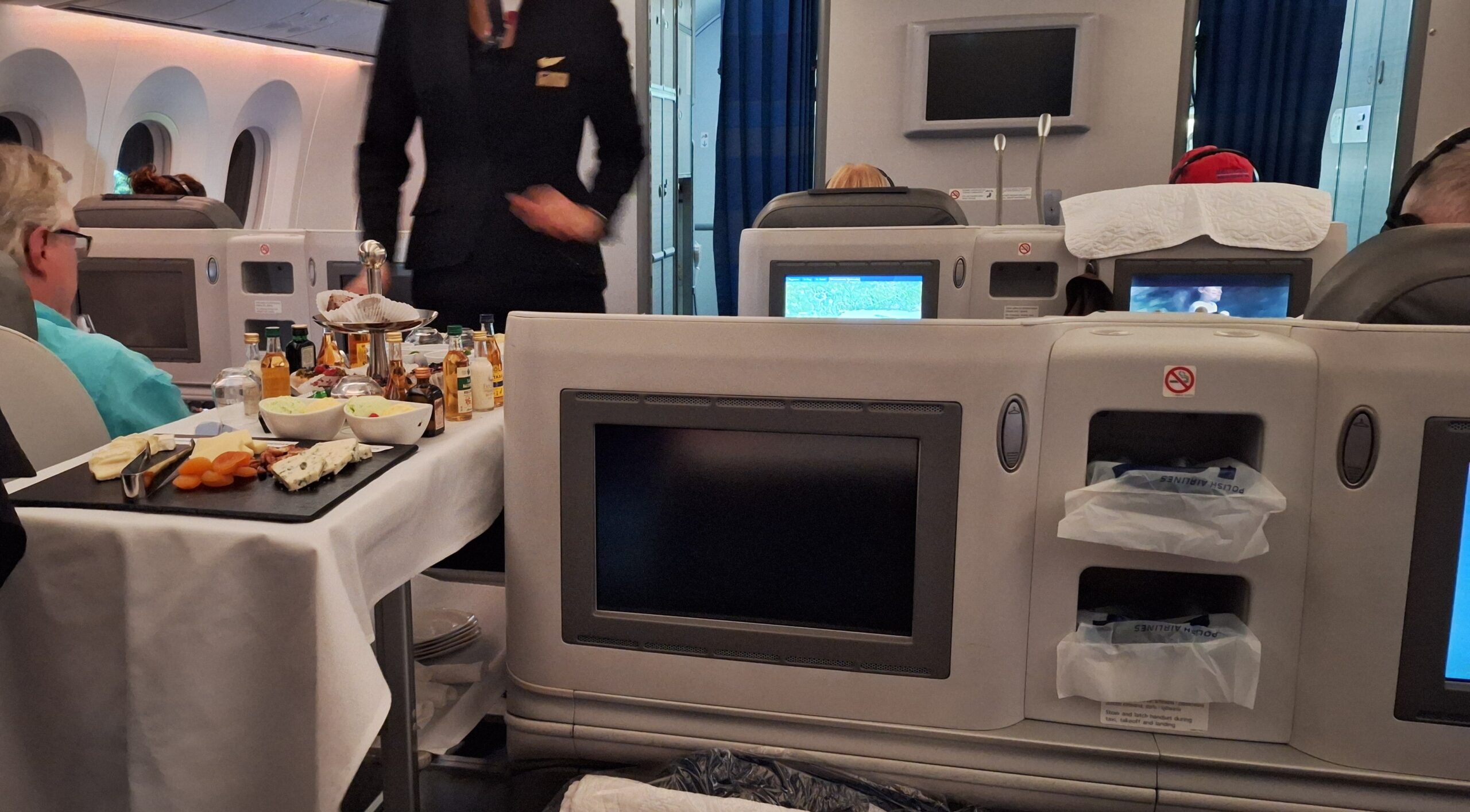 a man standing in front of a television