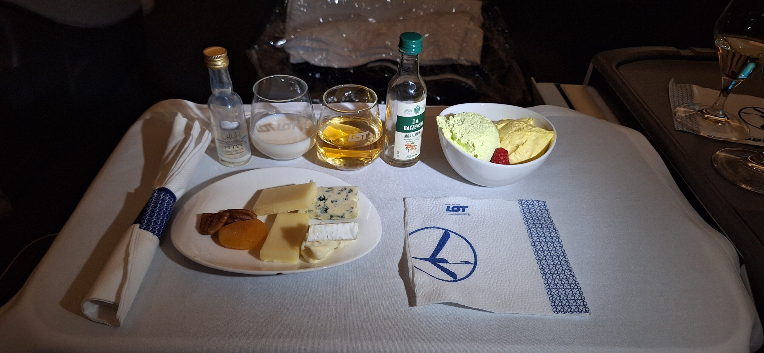a plate of food and glasses on a table
