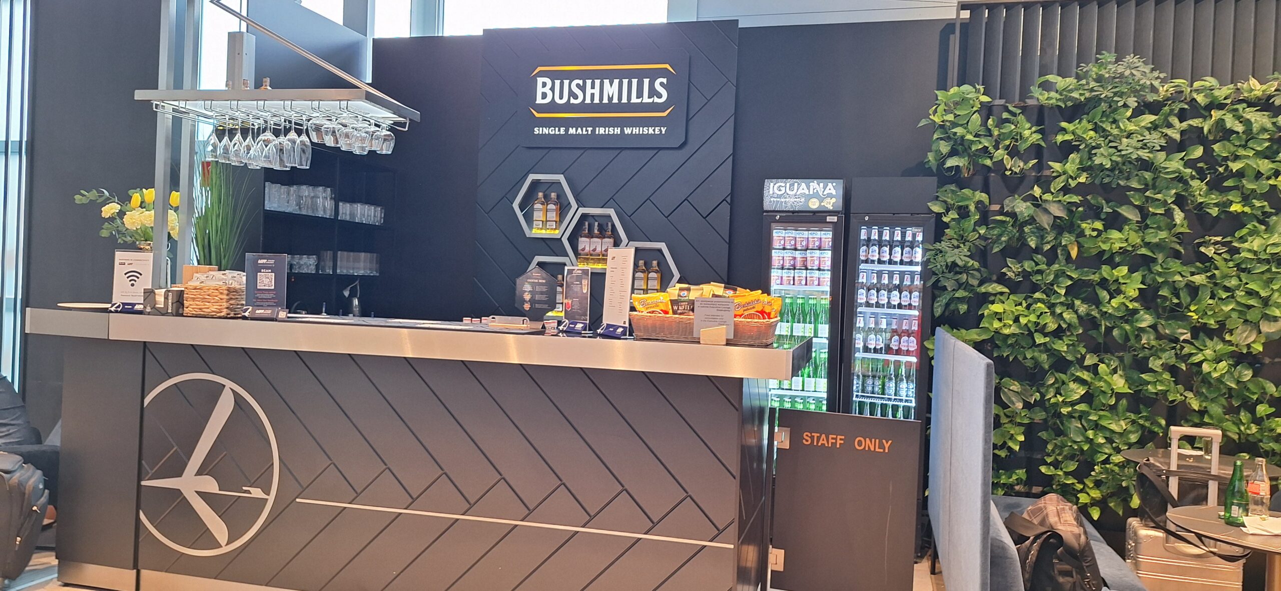 LOT Business Lounge review a bar with drinks and bottles