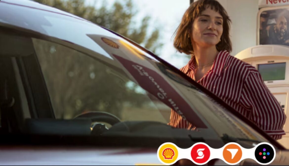 a woman standing next to a car