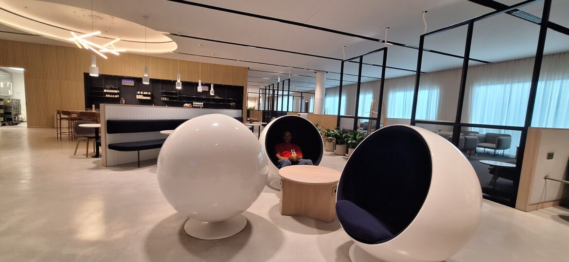 a man sitting in a round chair