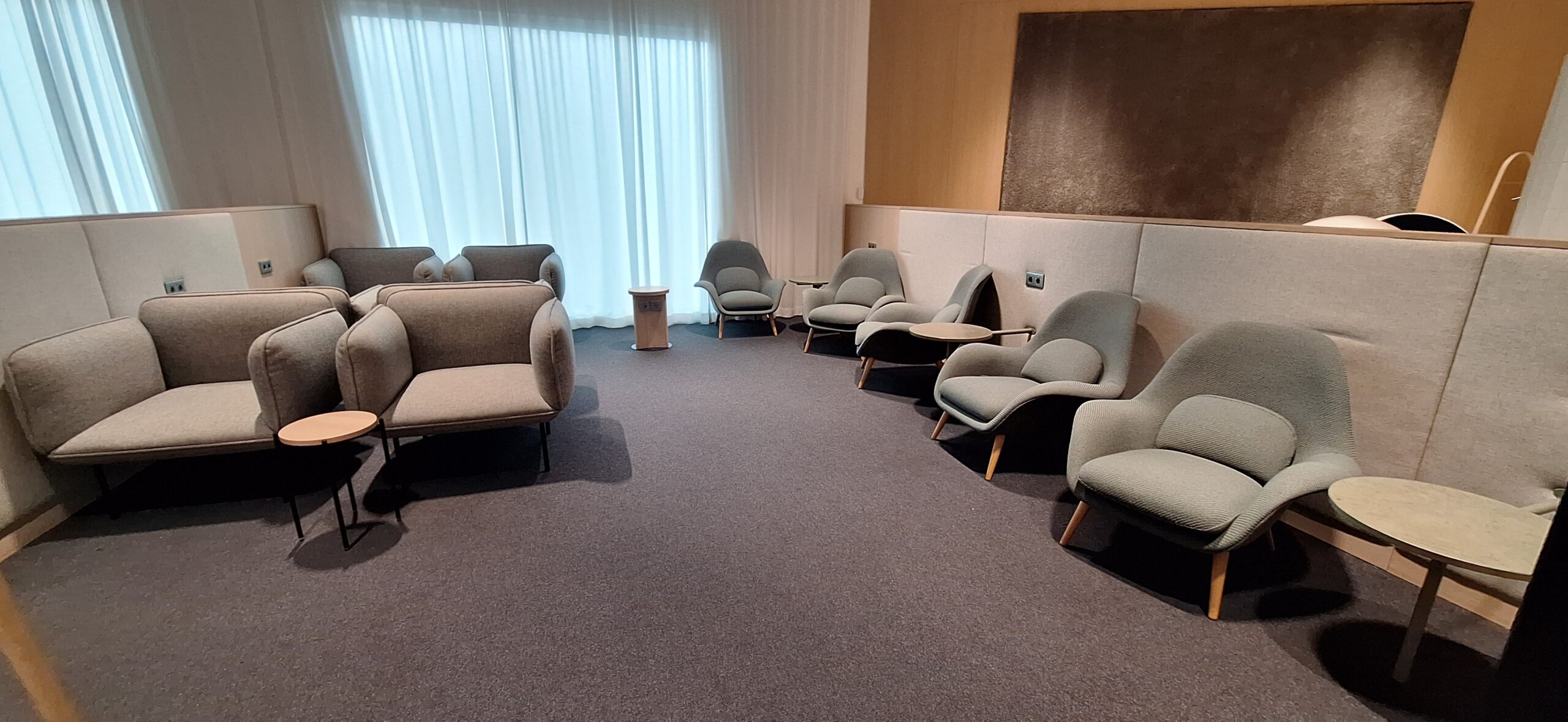 Finnair Business Class Lounge a room with chairs and a table