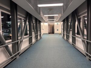 a hallway with a metal railing