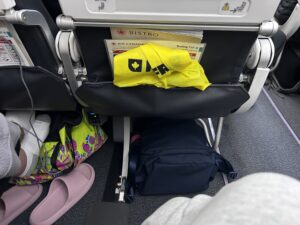 a yellow bag in the back of a chair