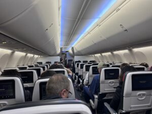 a group of people sitting in an airplane