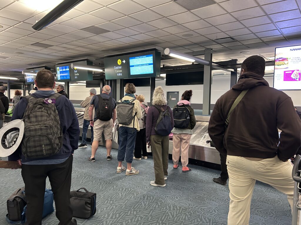 Airport Behaviour Unwritten Rules a group of people standing in a line