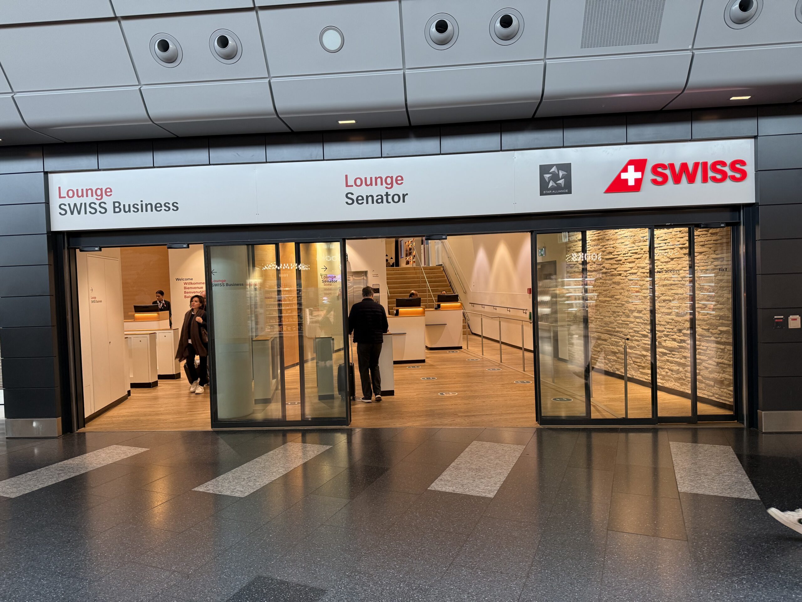 Swiss Senator Lounge Zurich Terminal A Review a glass doors in a building
