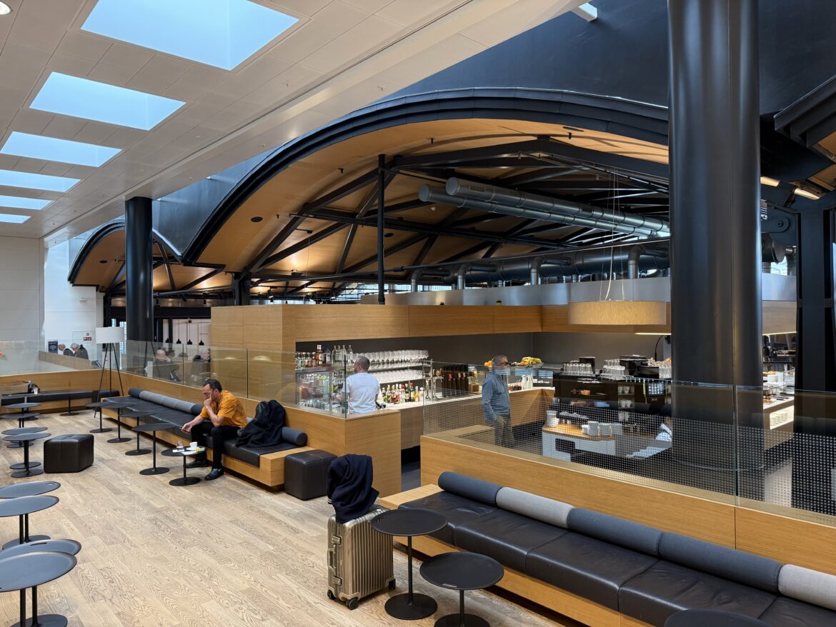 people sitting on benches in a building