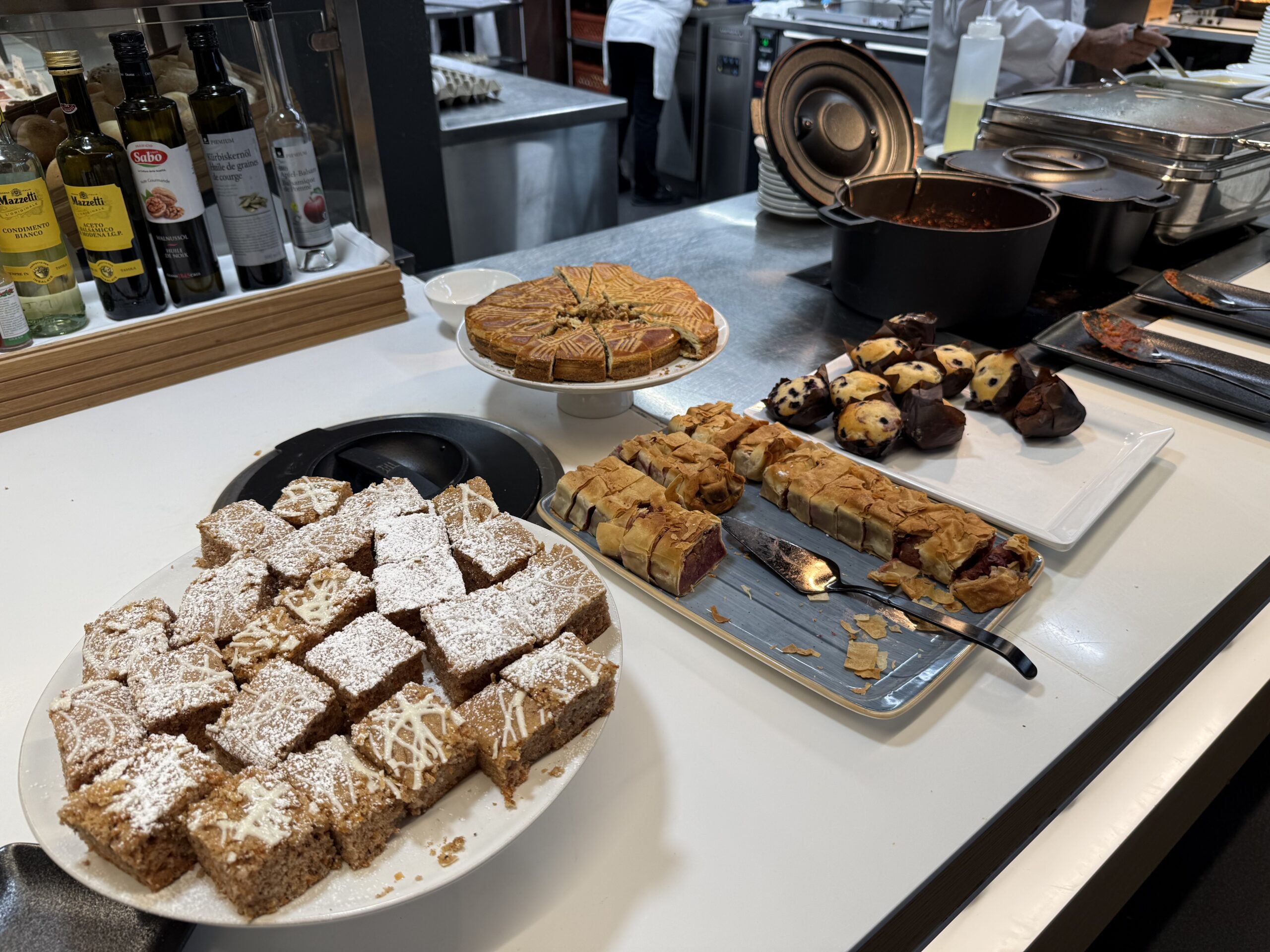 Swiss Senator Lounge Zurich Terminal A Review a table with food on it