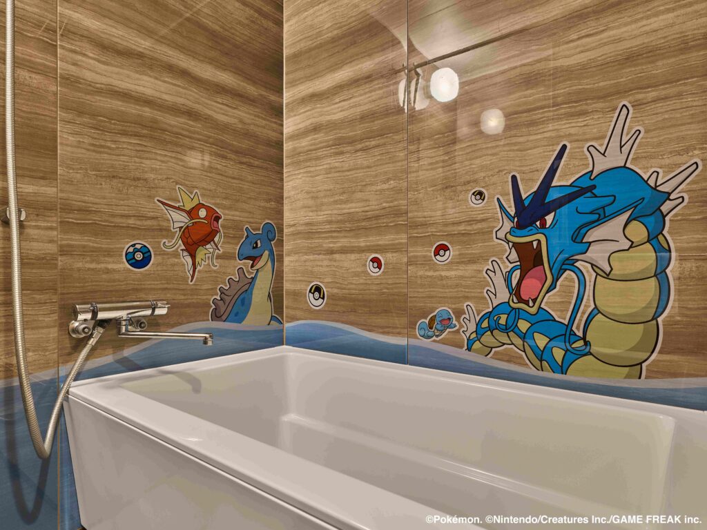 a bathtub with cartoon characters on the wall