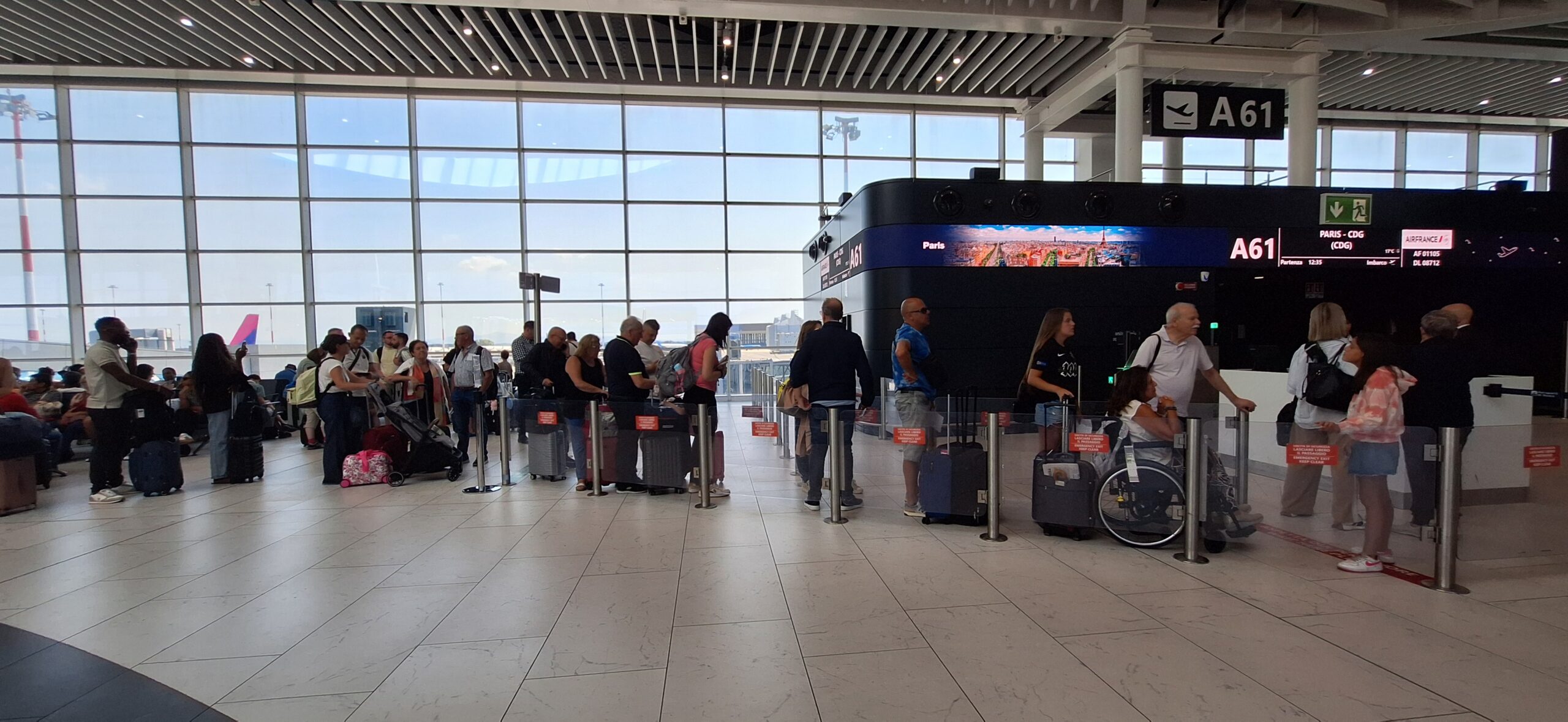a group of people standing in a terminal